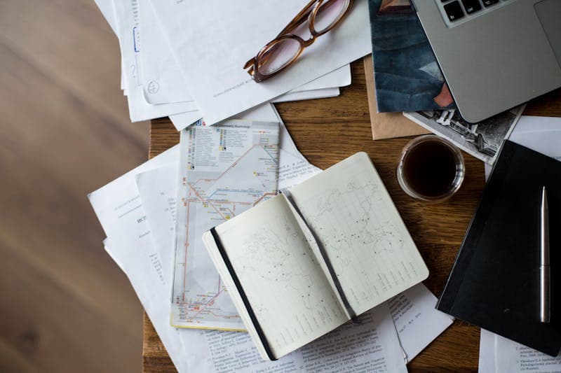 Desk with maps and planning notes